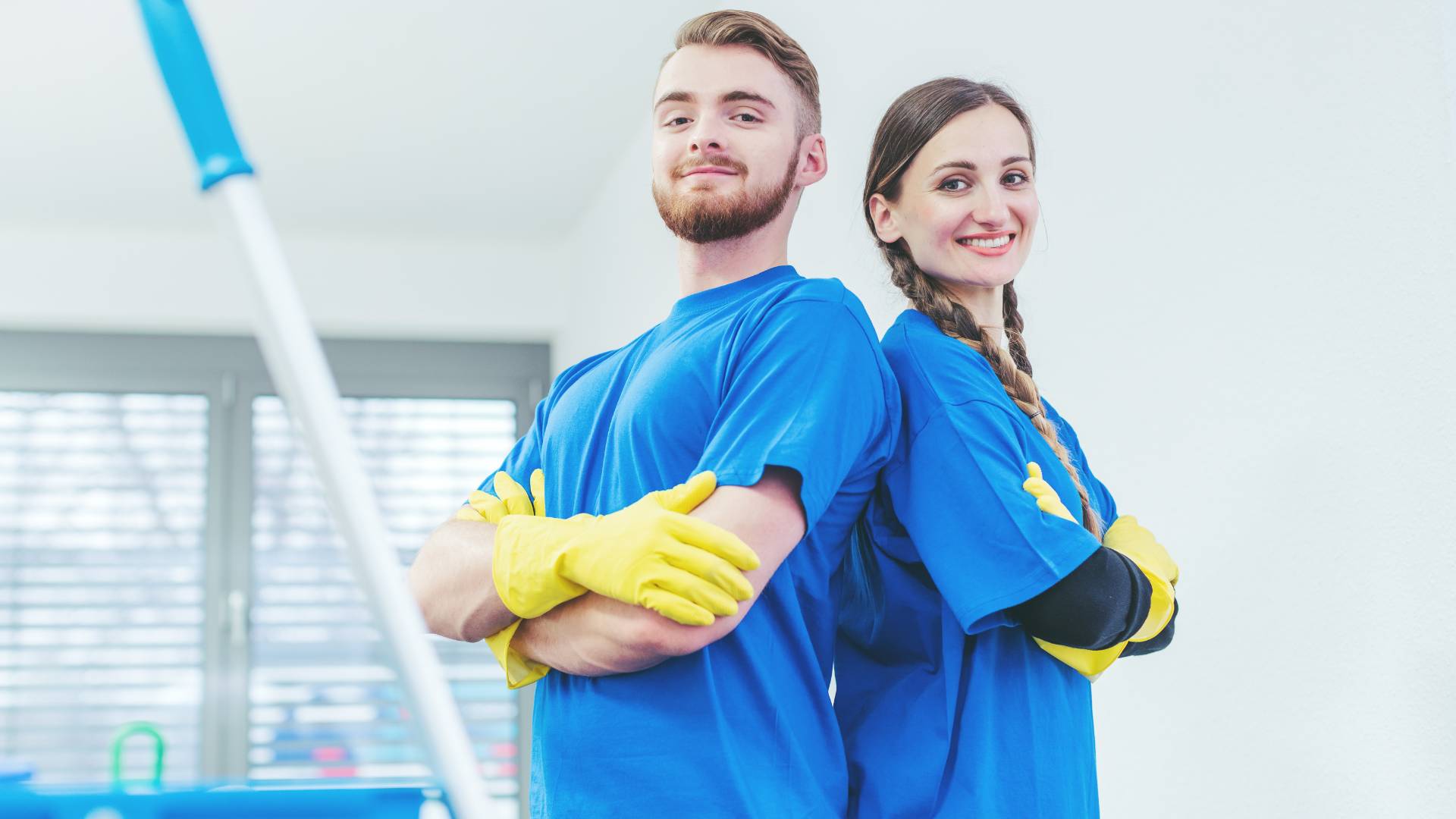 a man and a woman facing each others back ready to do professional bed bug extermination process